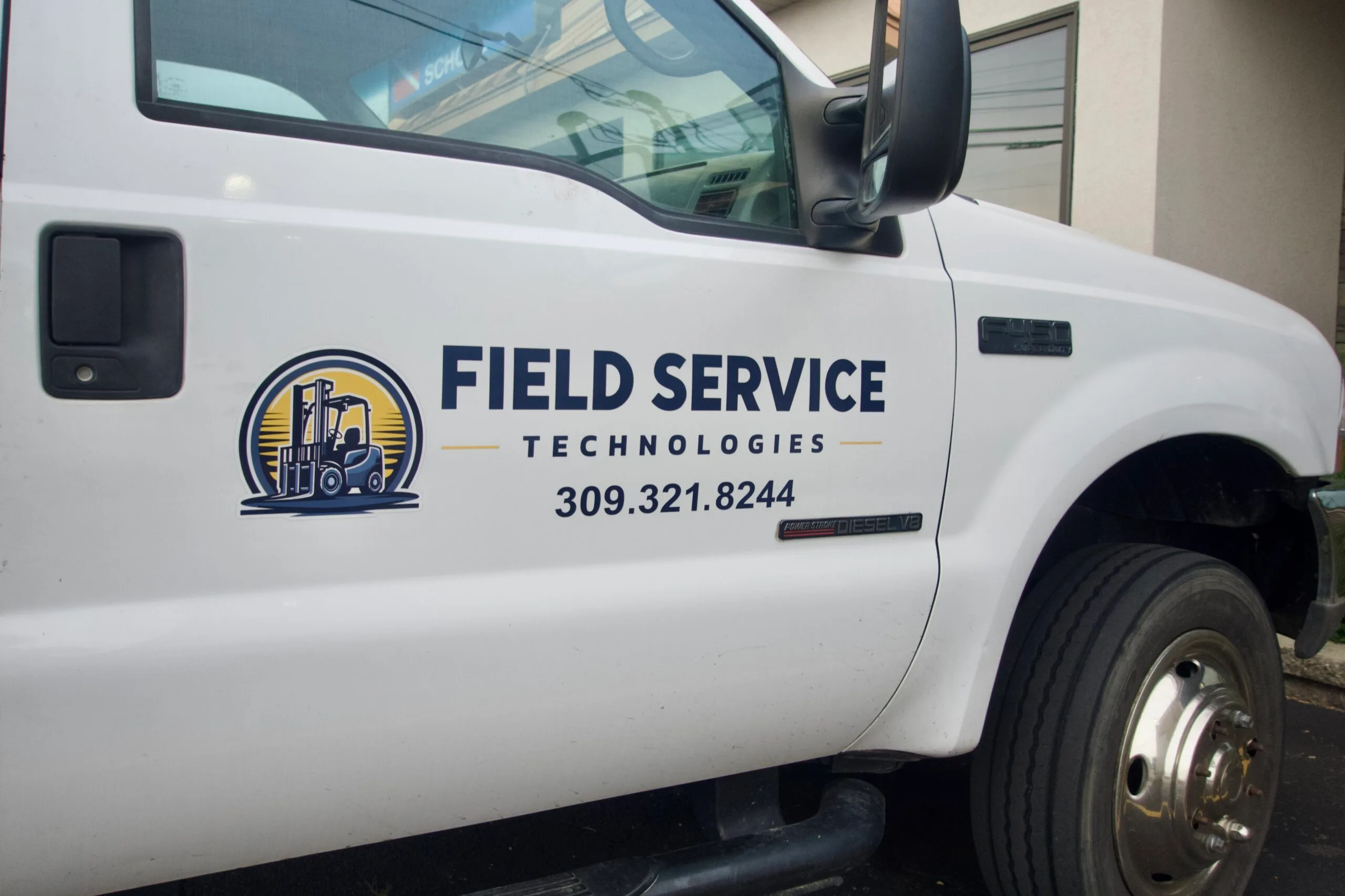 Custom vehicle graphics applied to a service truck by Best Made Signs